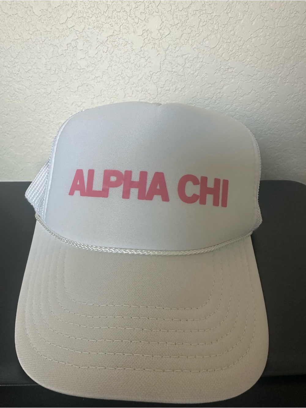 Alpha Chi White Trucker Hat with Pink Logo
